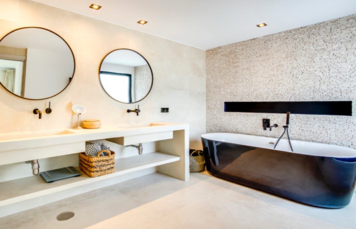 Stone bathroom with a freestanding tub