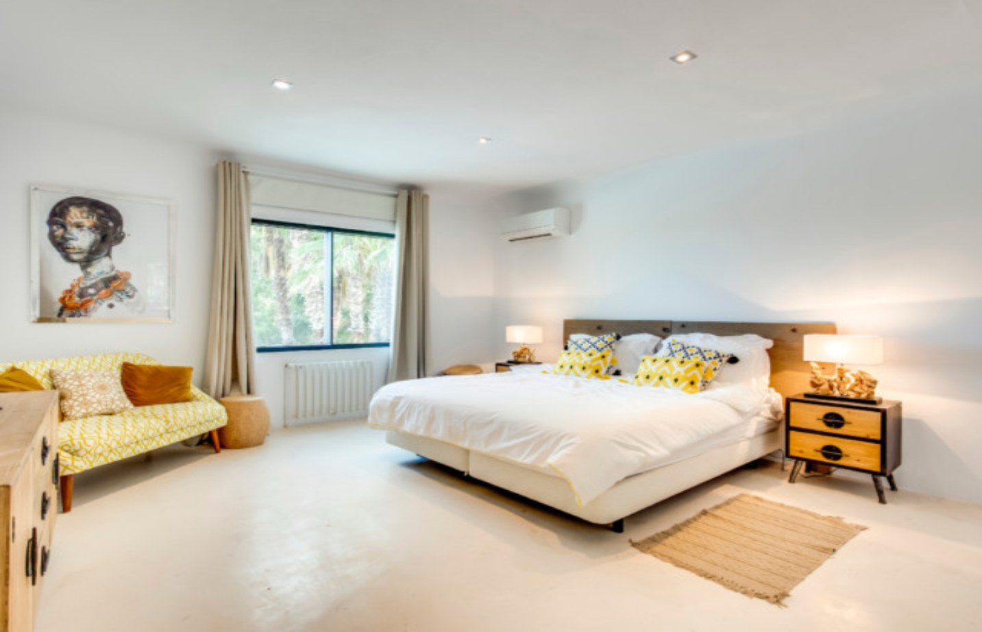 Light-filled bedroom with garden views